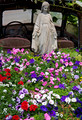 Flowers, truck and madonna statue