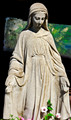 Madonna statue and flower